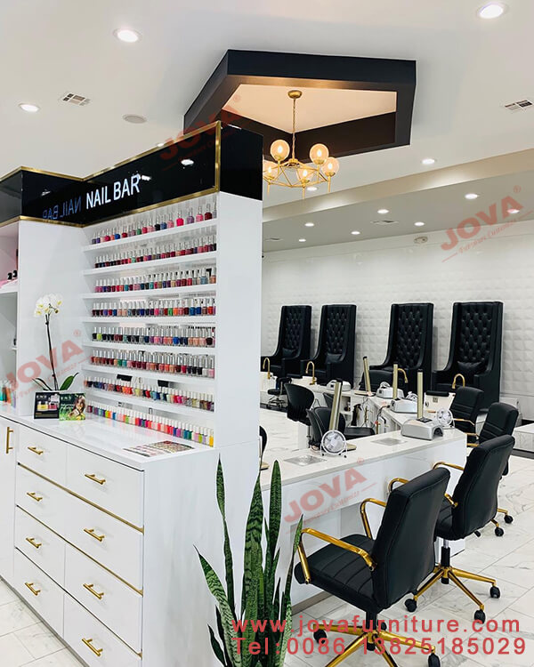 Nail wall displays and manicure tables